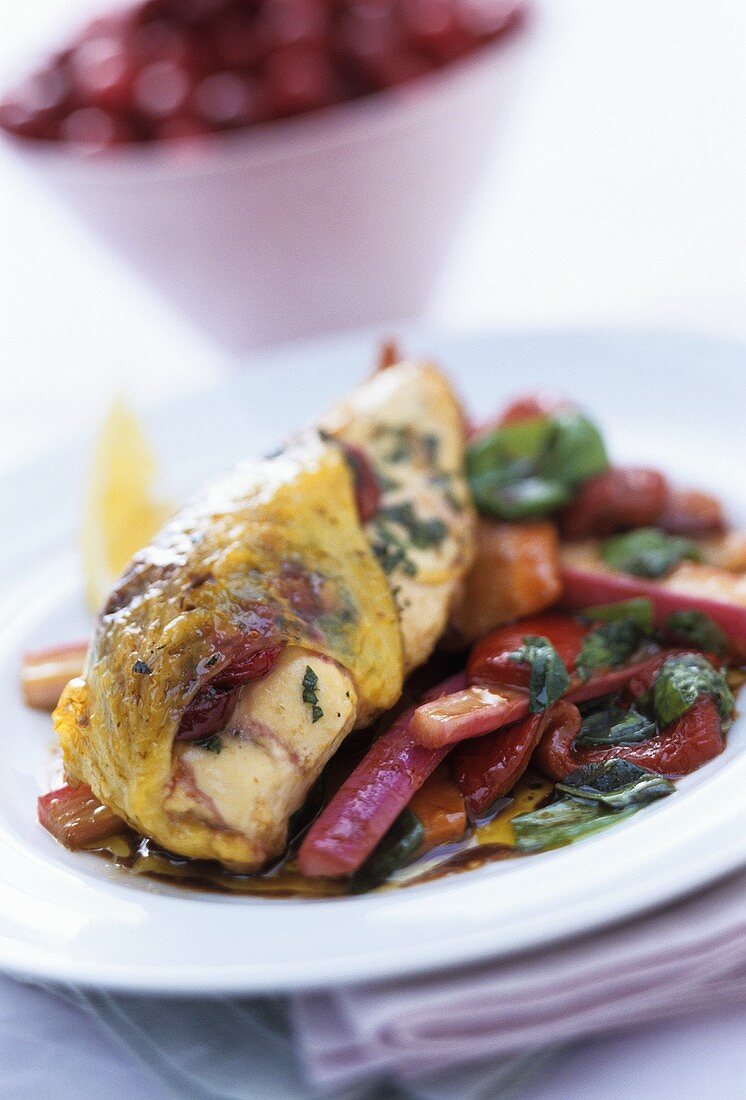 Chicken stuffed with cranberries on pepper and rhubarb salad