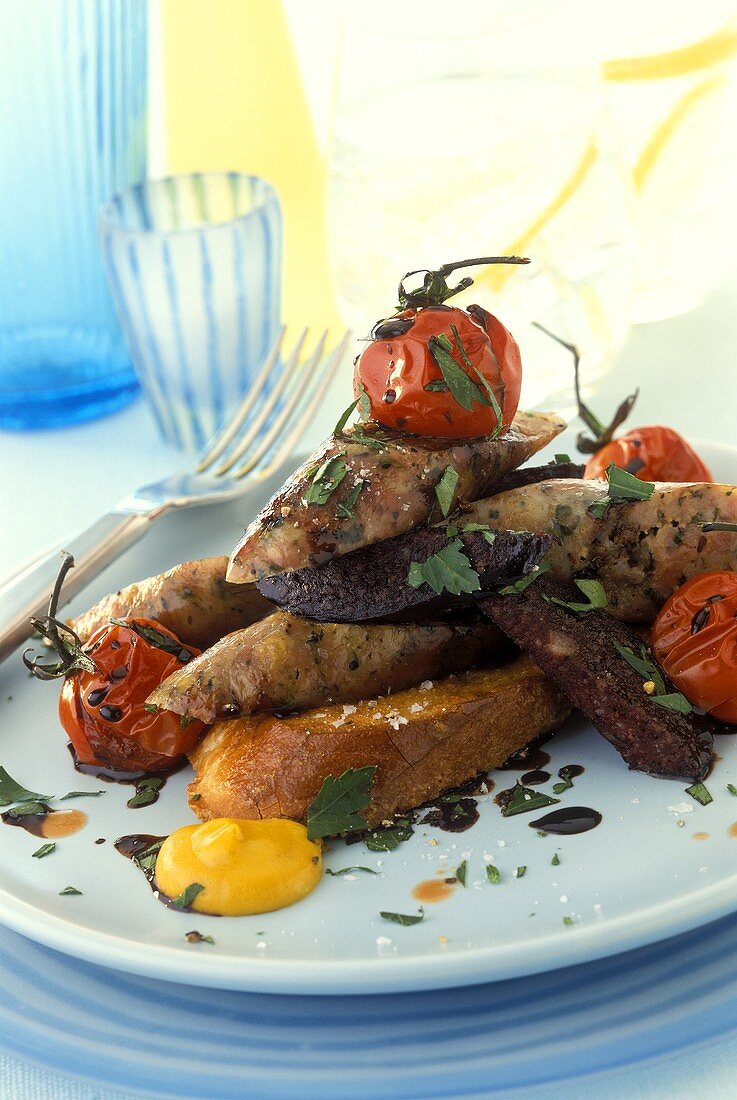 Sausage snack: fried pieces of sausage and tomatoes on toast