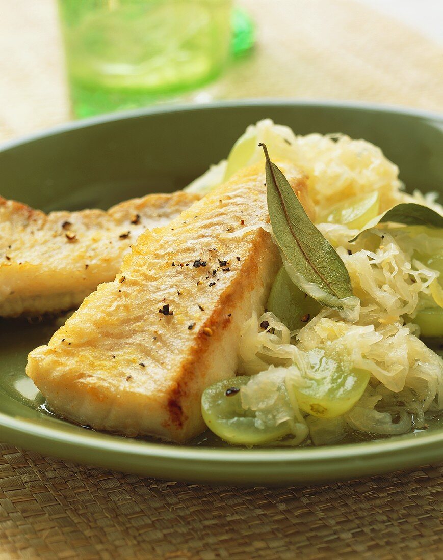 Fried coley fillet on sauerkraut