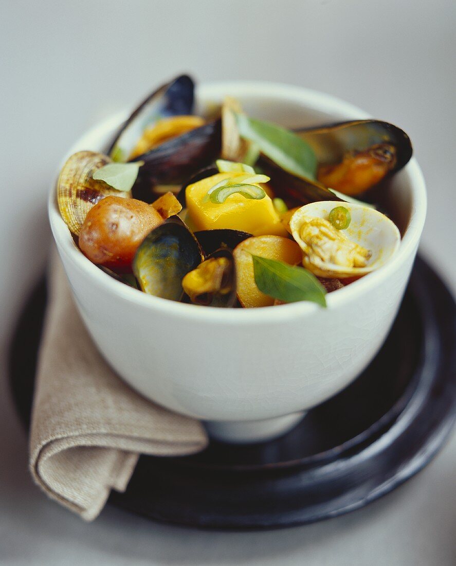 Cockles and mussels in mango and basil stock