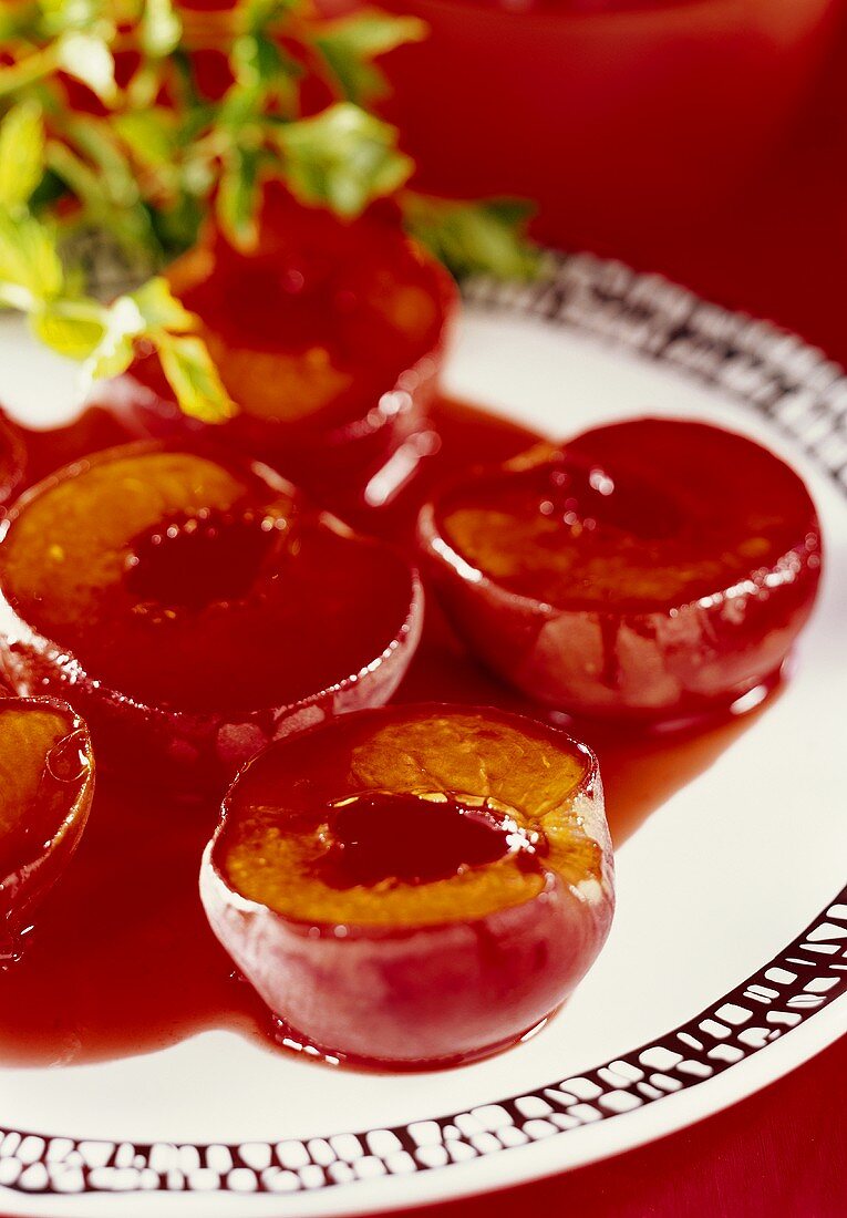 Baked peach halves with Grenadine syrup