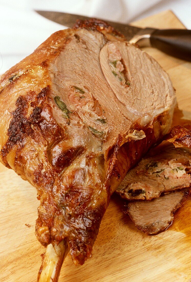 Roast leg of lamb studded with anchovies and rosemary