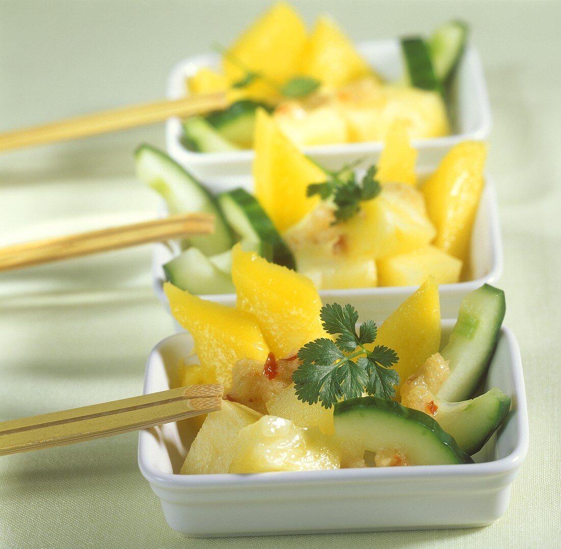 Cucumber salad with mango, pineapple and chili