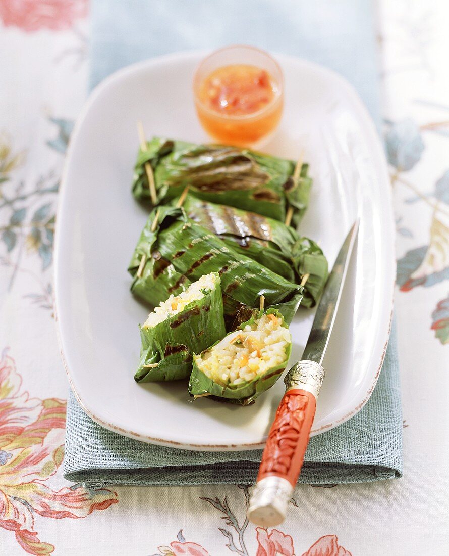 Barbecued banana leaf parcels with vegetable rice filling