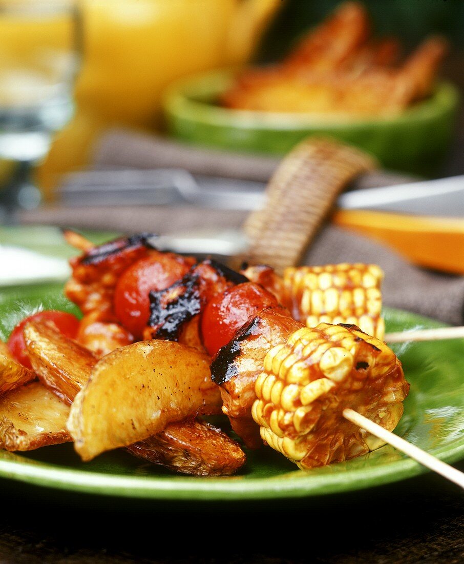 Barbecued vegetable kebabs and country potatoes