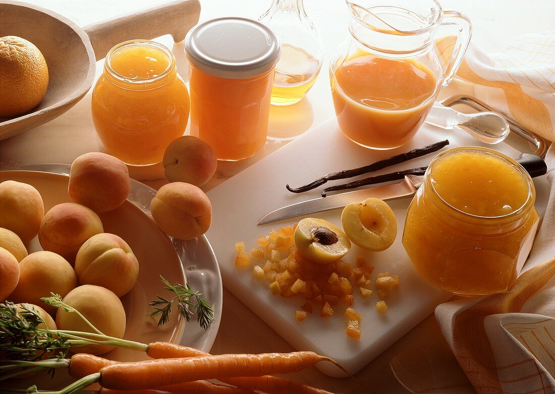 Still life with apricot, orange and carrot jam and ingredients