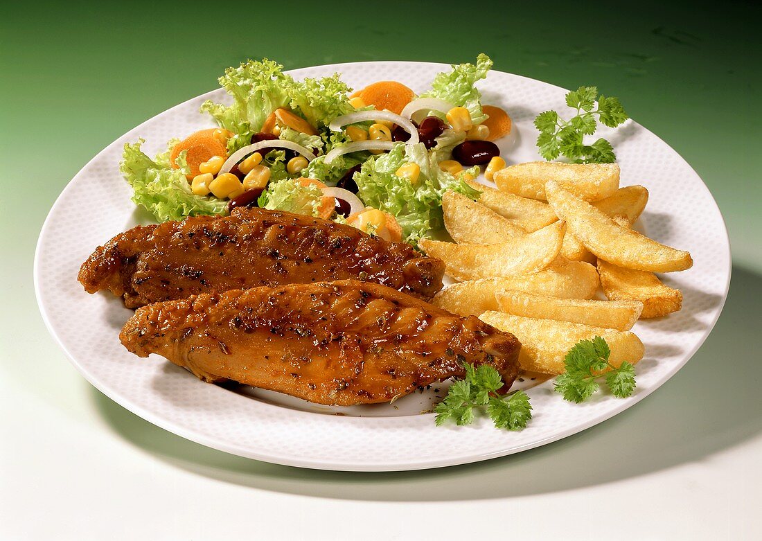 Poularde wings with chips and salad