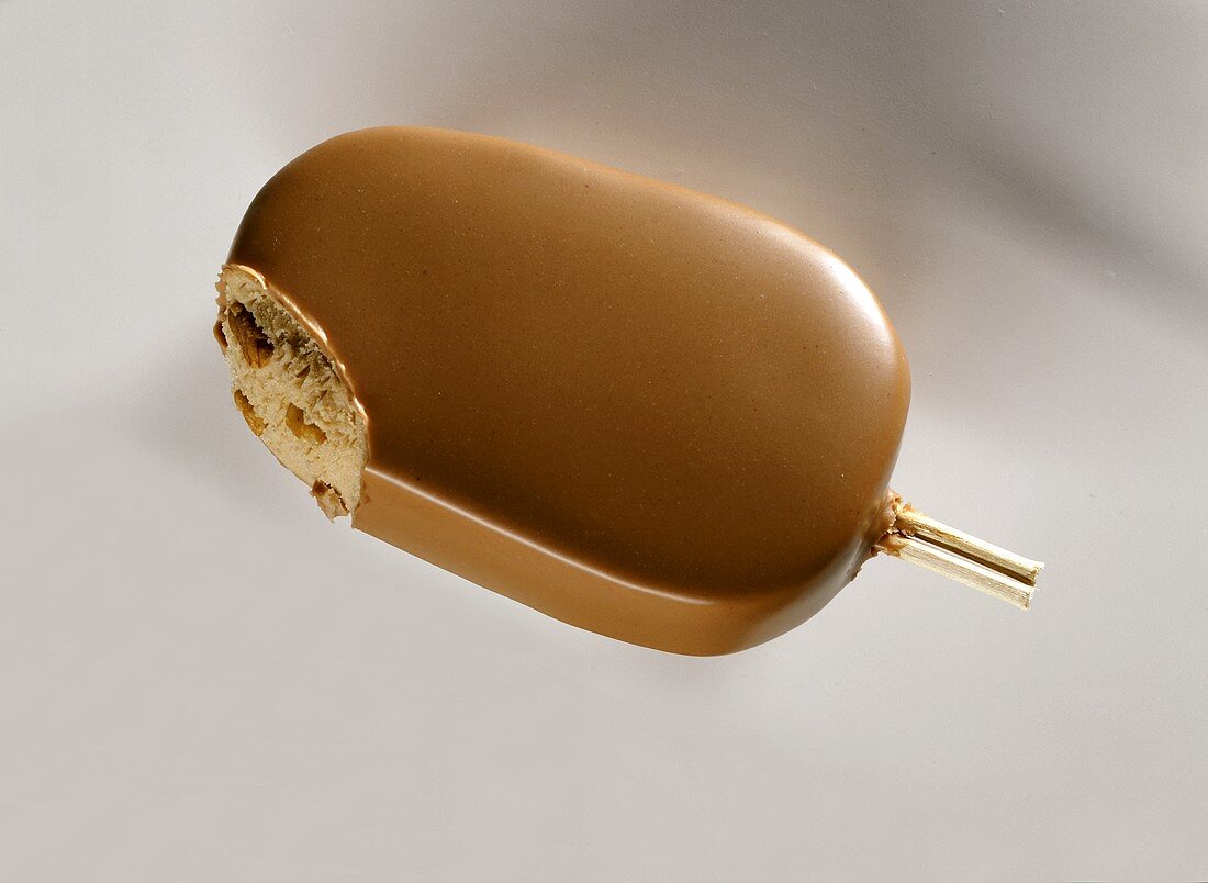 Hazelnut ice cream with hazelnut coating on stick