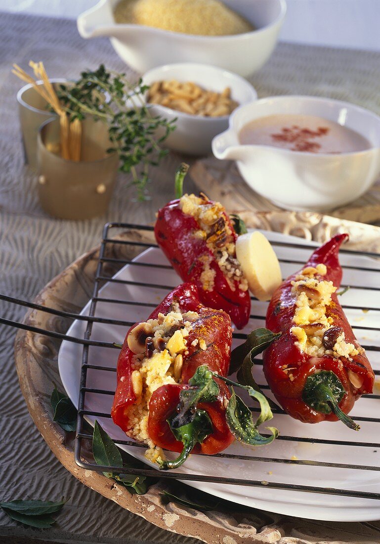 Stuffed peppers with couscous, pine nuts and raisins