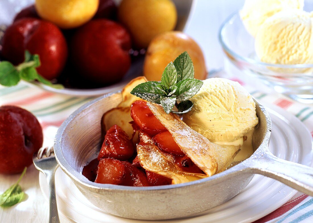 Crepe with caramelised plums and vanilla ice cream