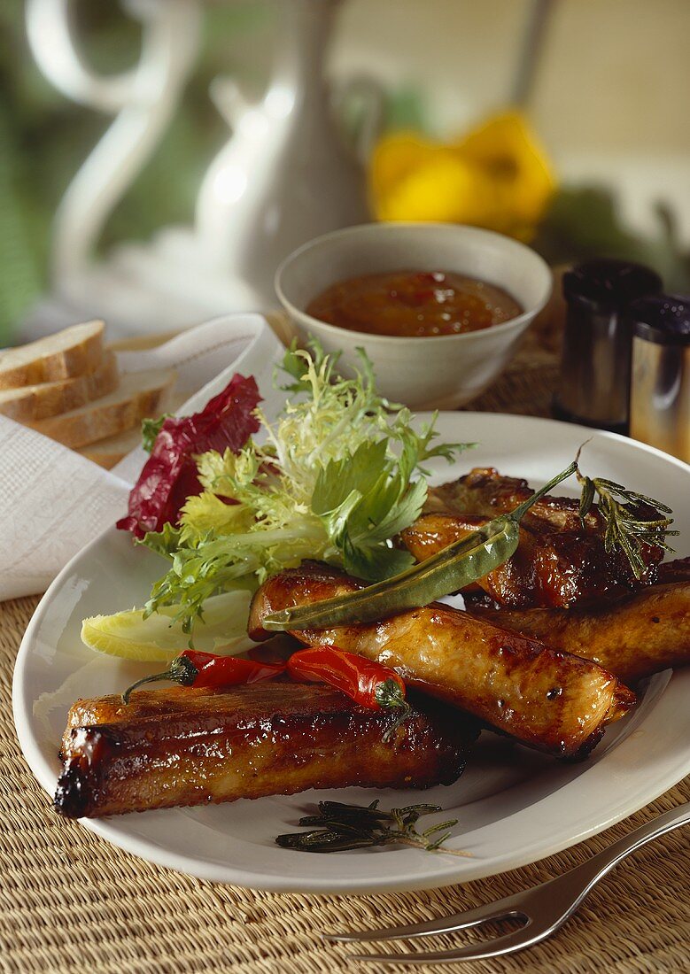 Spare-ribs with barbecue sauce and salad
