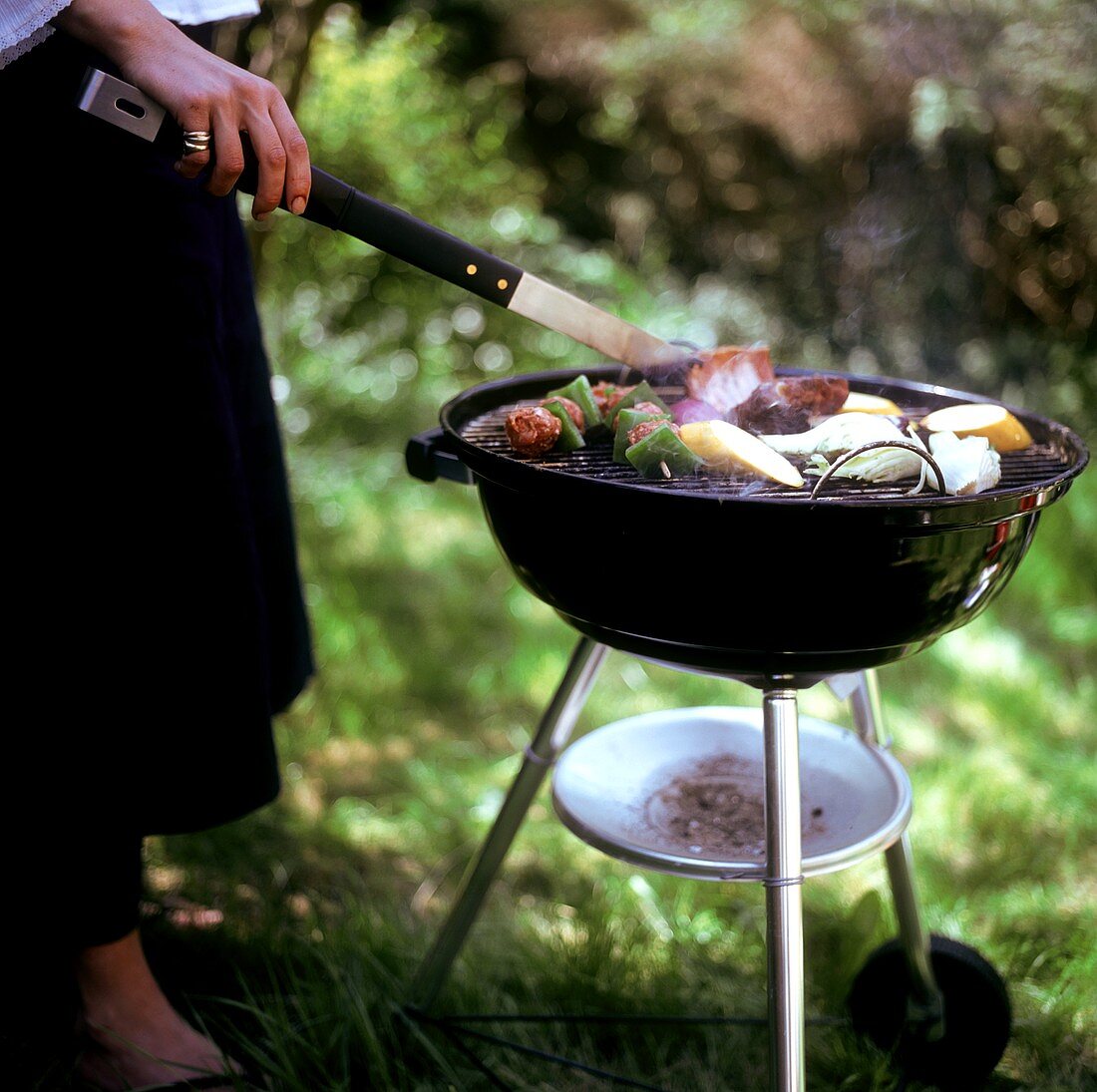 Mince kebabs and vegetables on the barbecue