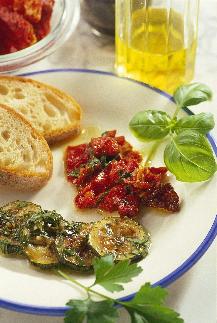 Bottled courgettes and dried tomatoes with white bread