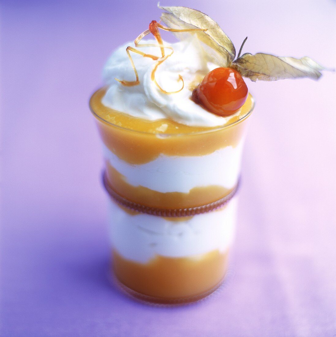 Layered dessert with mango and cream mousse