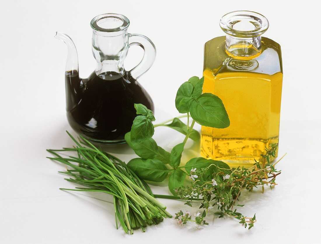 Aceto balsamico, oil, herbs (ingredients for herb vinaigrette)