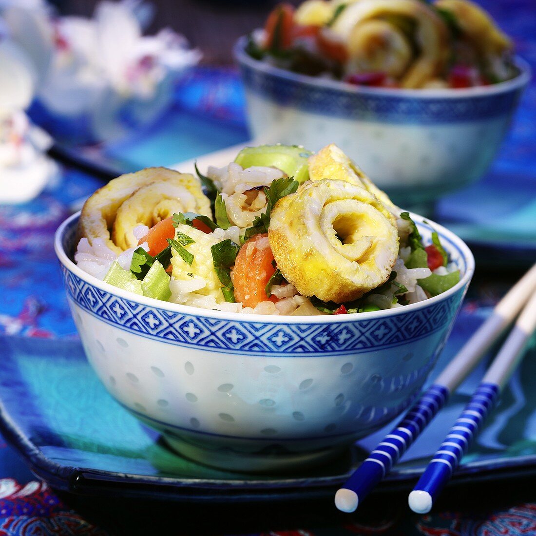 Nasi goreng with vegetables, coriander and pancake rolls