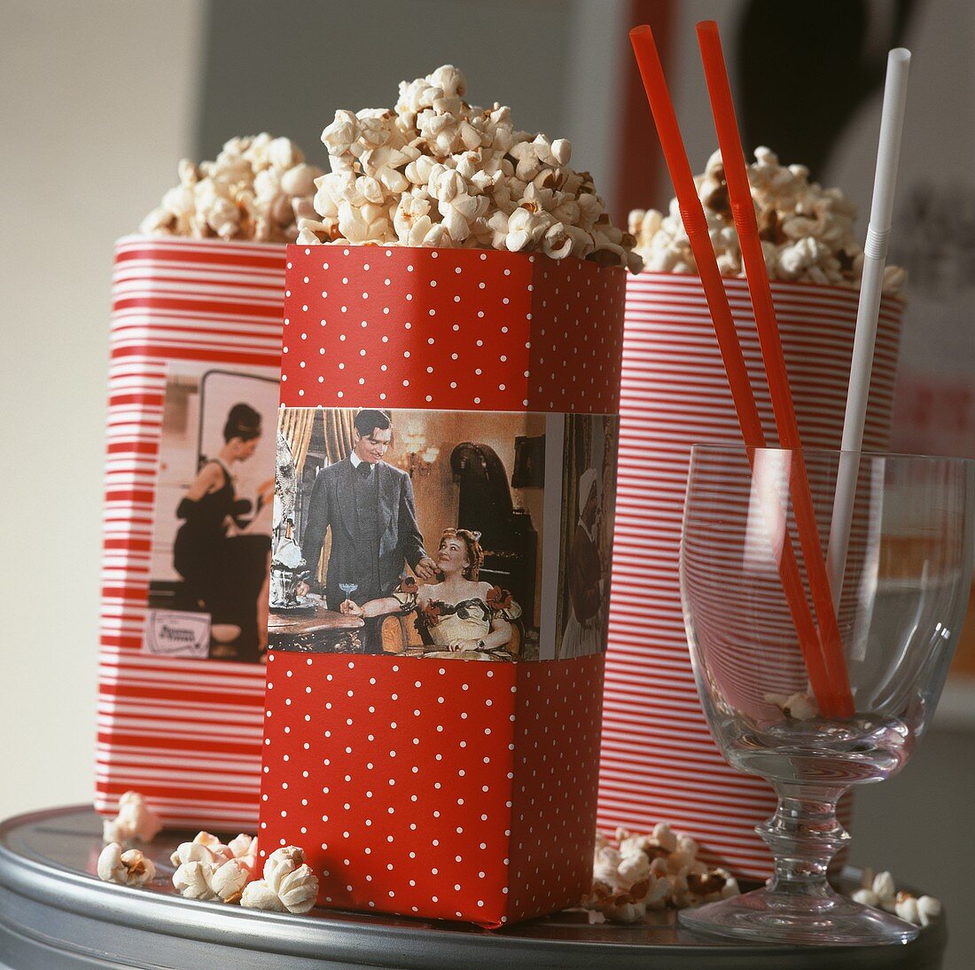 Popcorn in paper bags with cinema motifs