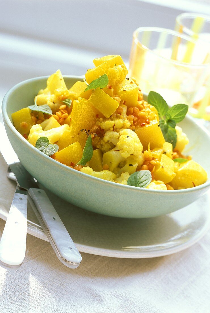 Pumpkin and potato salad with cauliflower and red lentils