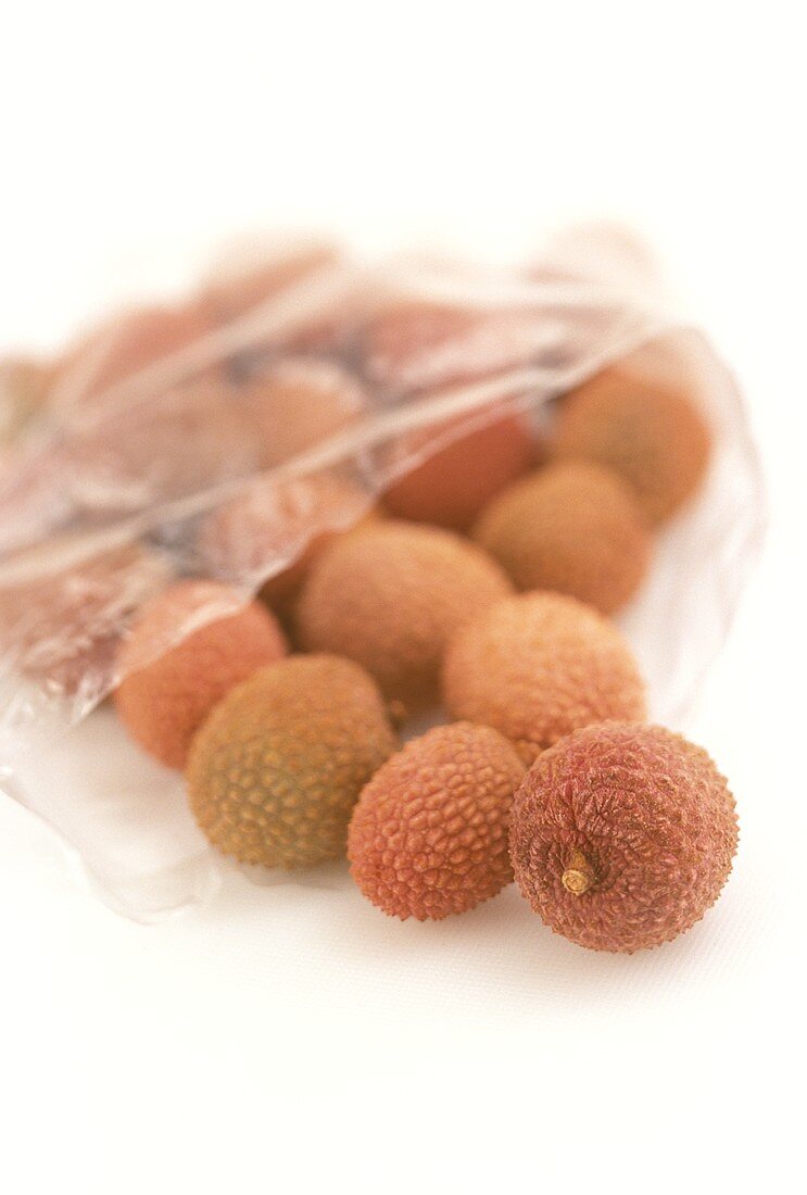 Fresh lychees in a transparent bag