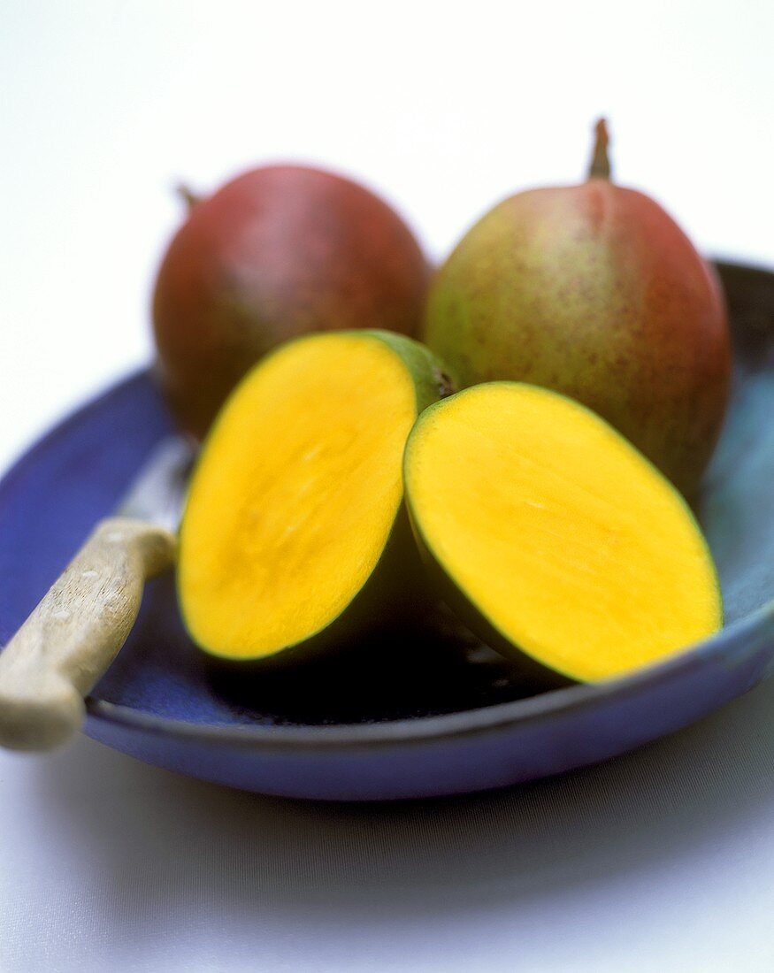 Mangos, one cut open