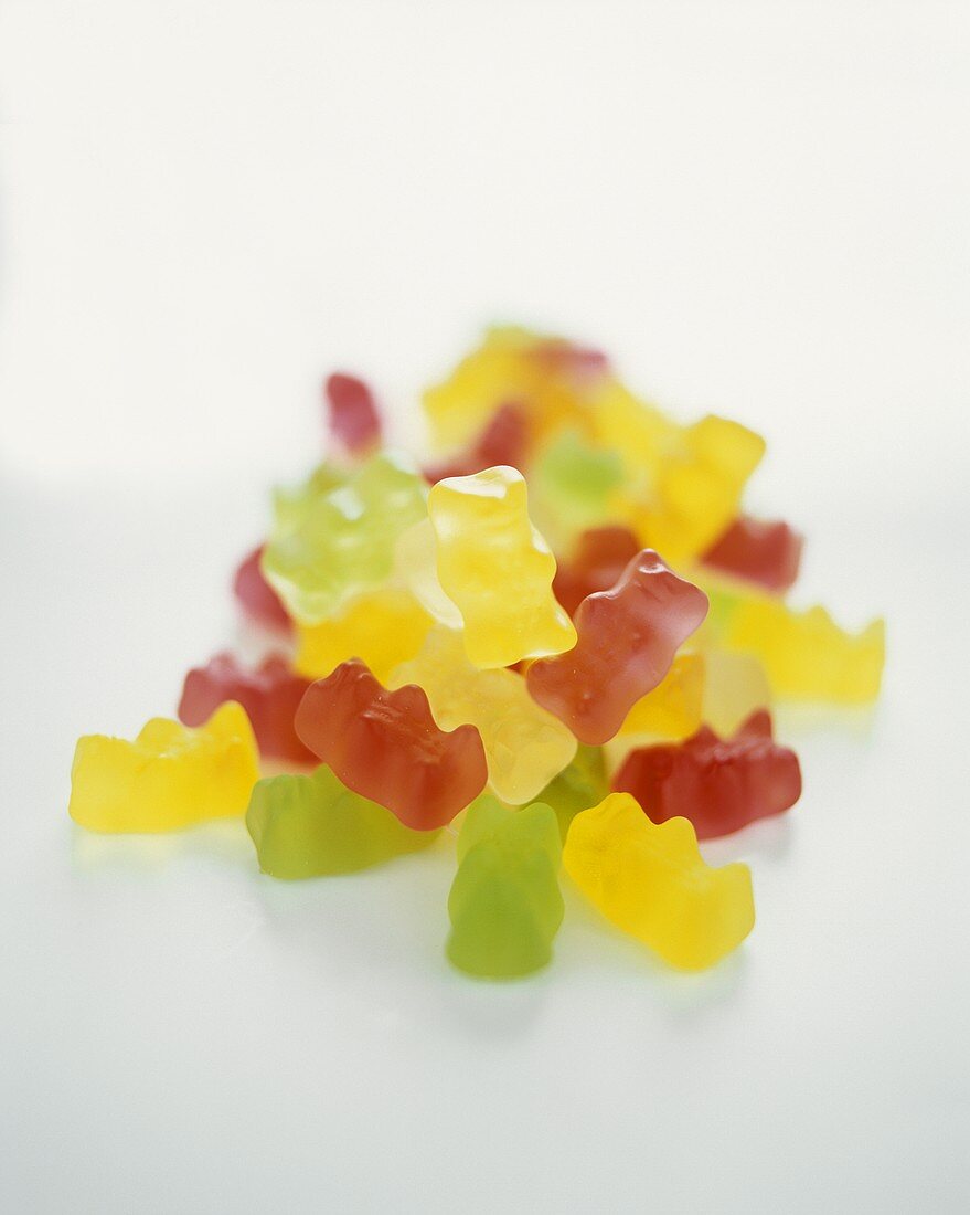 Gummi bears on a sheet of glass 