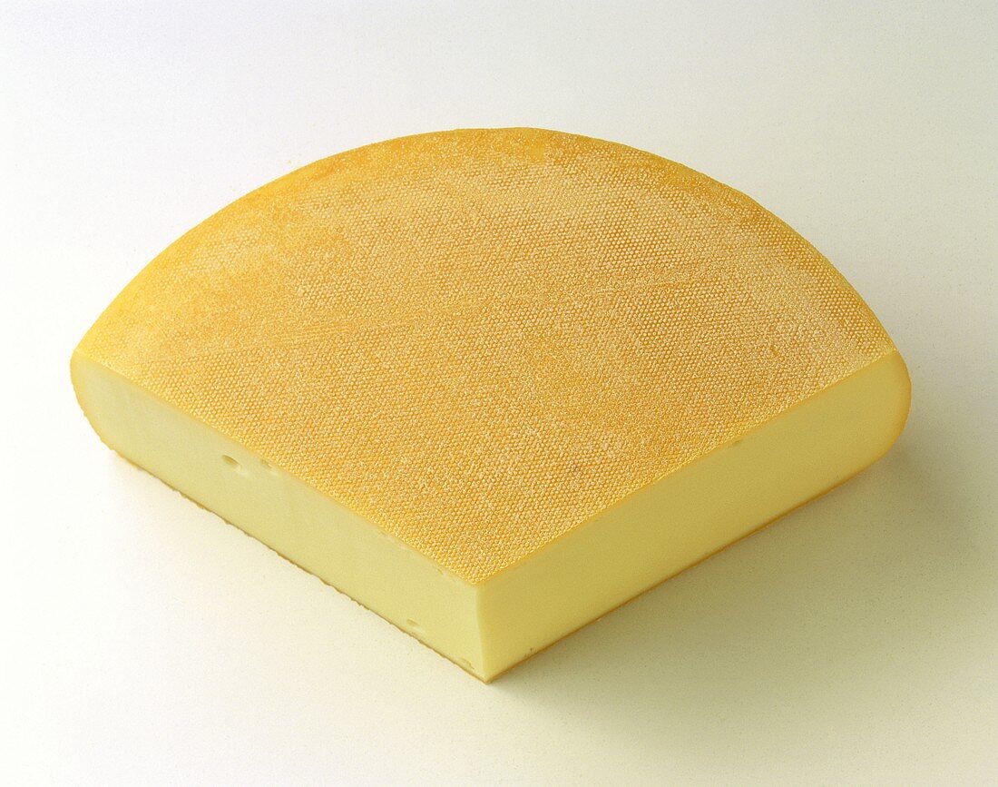 A quarter of a raclette cheese