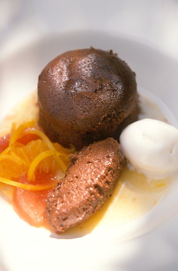 A small chocolate cake, mousse au chocolat and lemon sorbet
