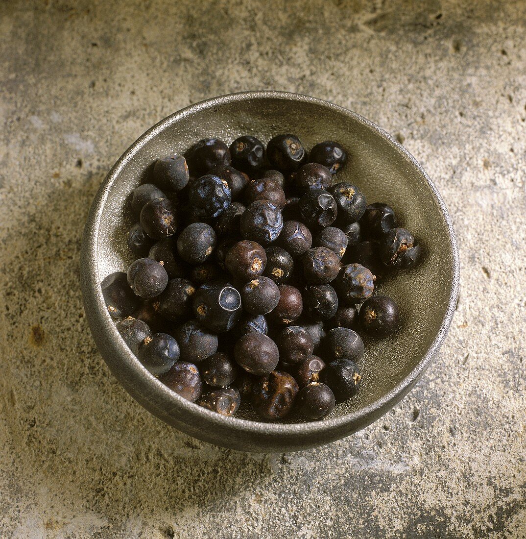 Juniper berries in an iron bowl