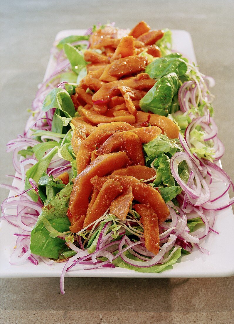 Salad with baked pumpkin strips