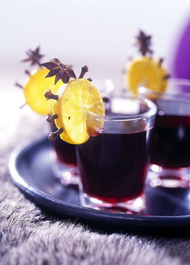 Mulled wine with orange slices studded with cloves
