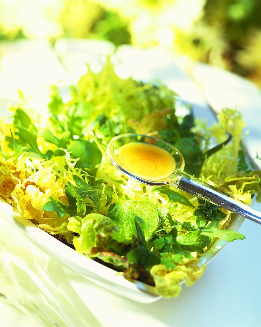 Salad dressing in spoon