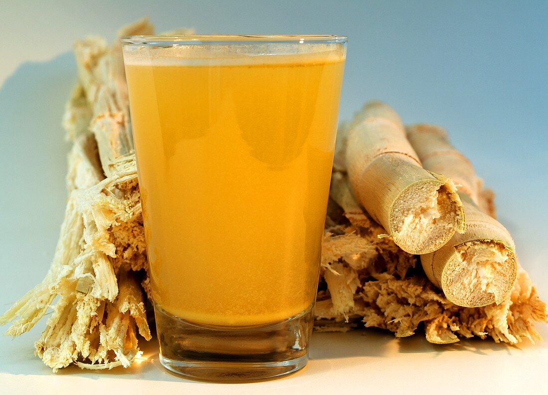 Glass of sugar cane juice (Garapa) and sugar cane fibres
