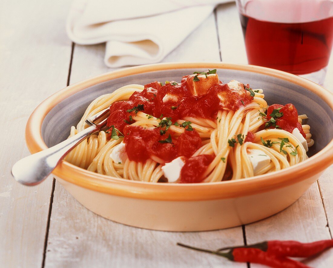 Spaghetti with spicy tomato sauce and ricotta