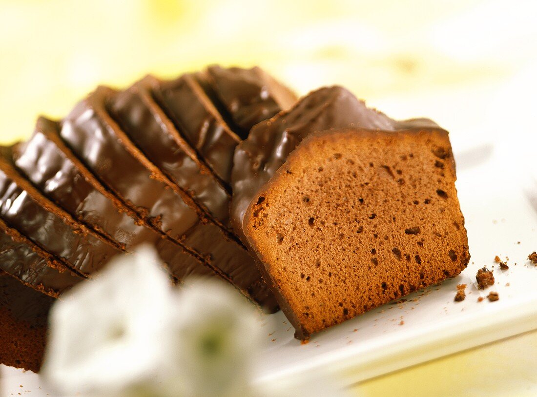 Chocolate cake with couverture, sliced