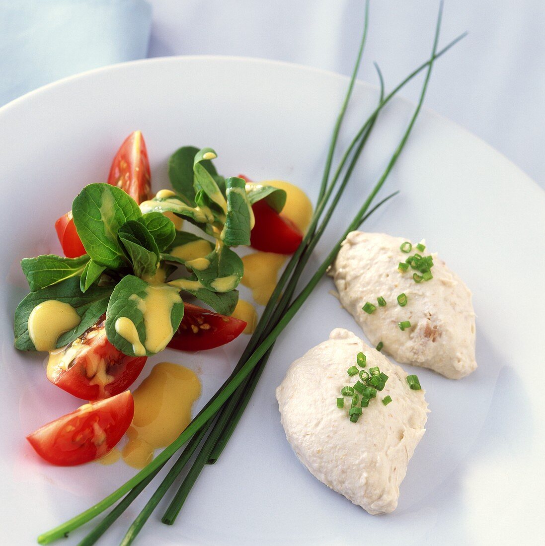 Mackerel mousse with corn salad, tomatoes and chives