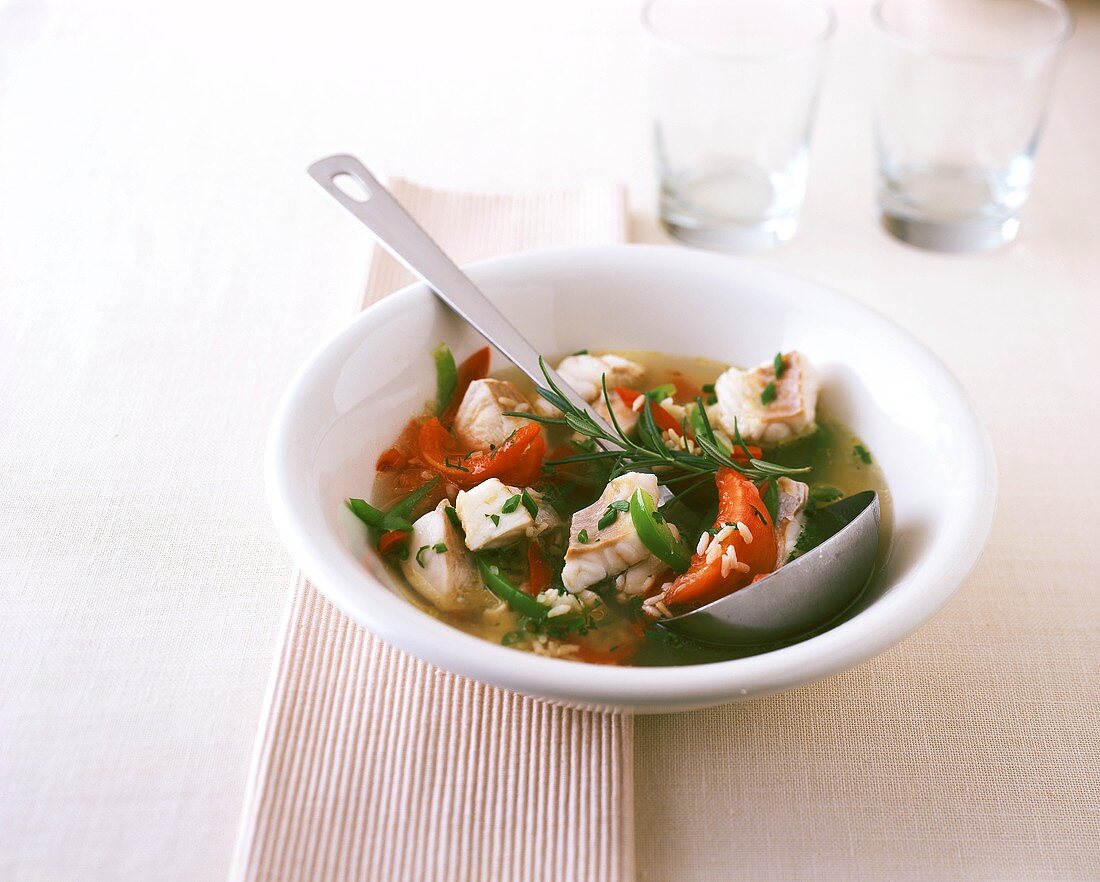 Spanish fish soup with tomatoes and peppers