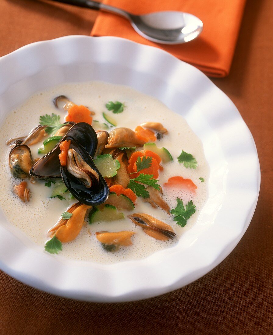 Mussel soup with vegetable flowers