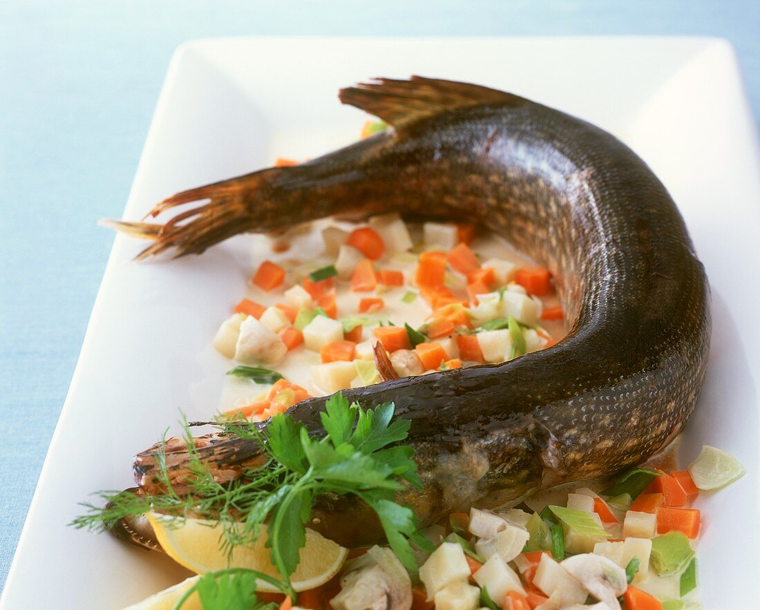 Pike cooked in roasting sleeve with vegetable sauce