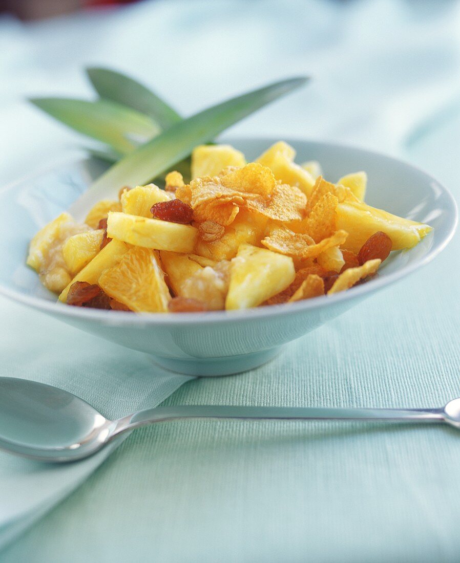 Pineapple salad with cornflakes and raisins