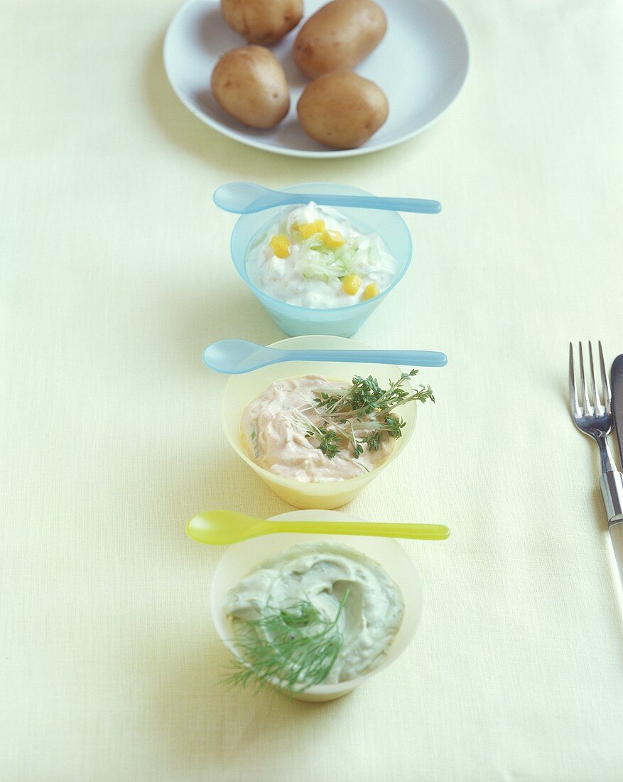Potatoes boiled in their skins with three quark dips
