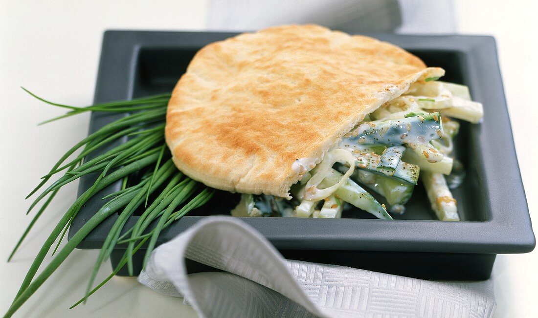 Filled pita bread with vegetables and chives