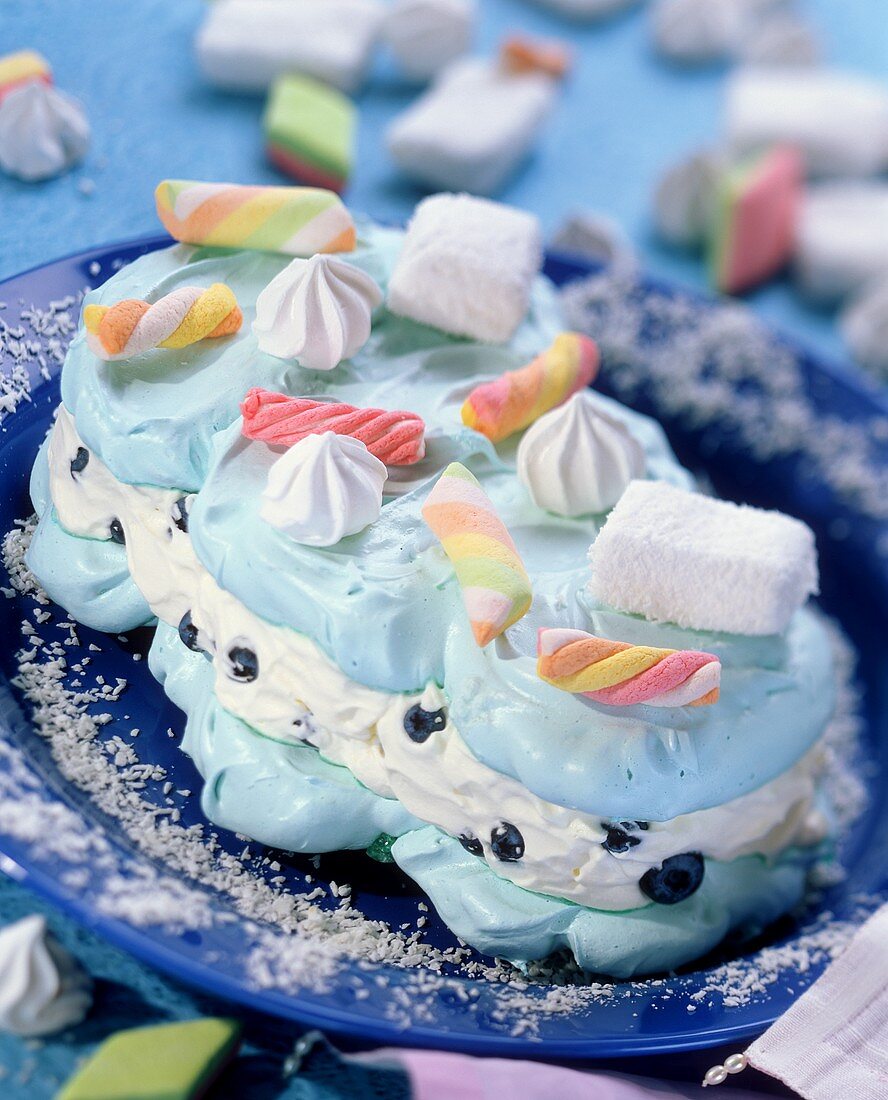 Sugar cloud (meringue cake with blueberries and candy sticks)