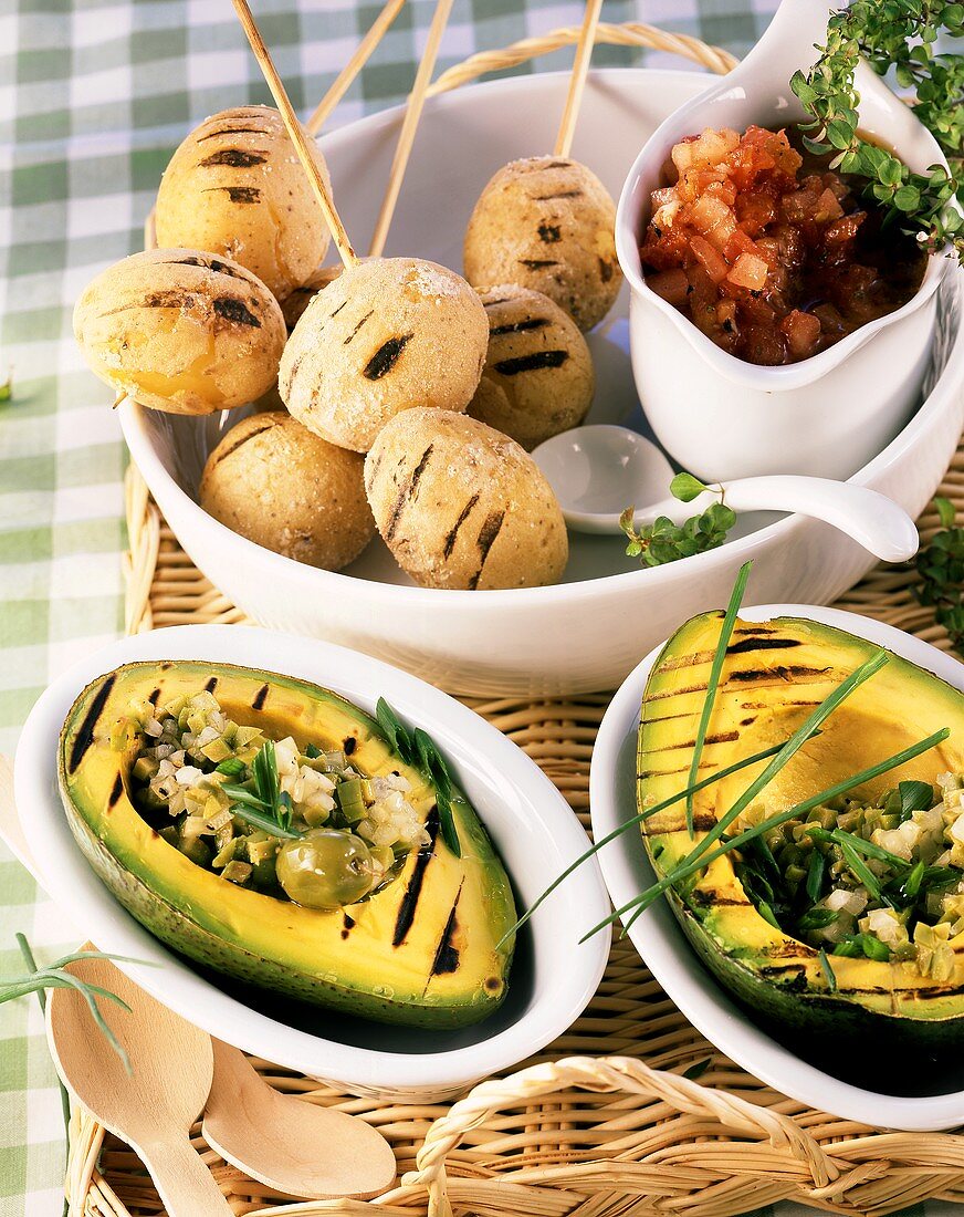 Barbecued avocados with olive salad and potatoes with sea salt