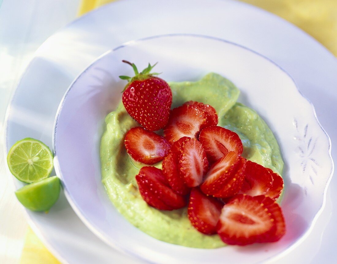 Strawberries on avocado cream