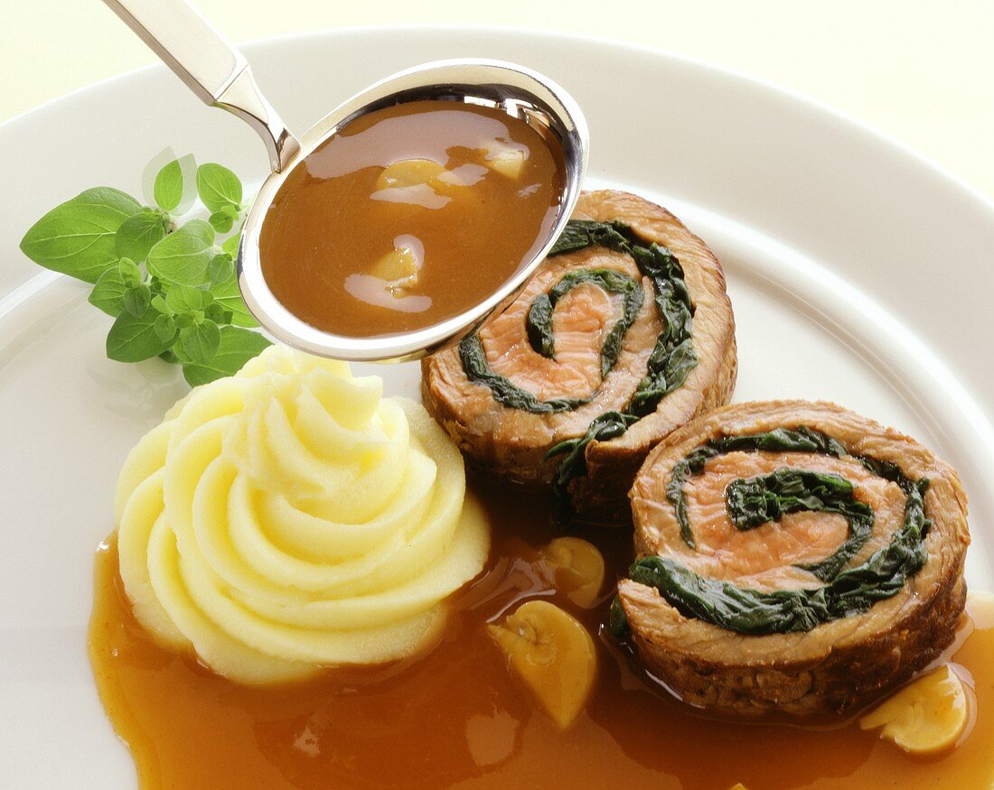 Veal roulade with spinach stuffing and mushroom sauce