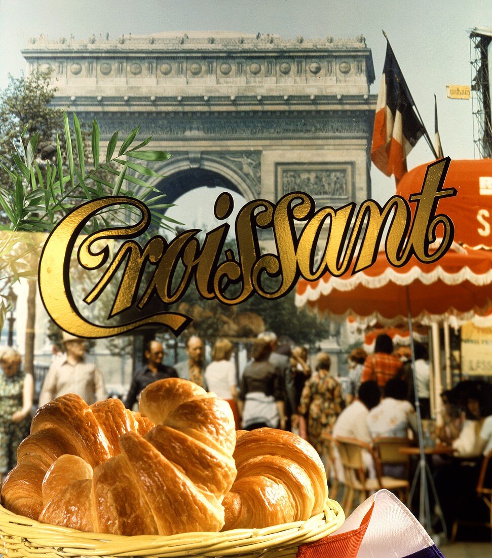 Fresh croissants, Arc de Triomphe behind, Paris