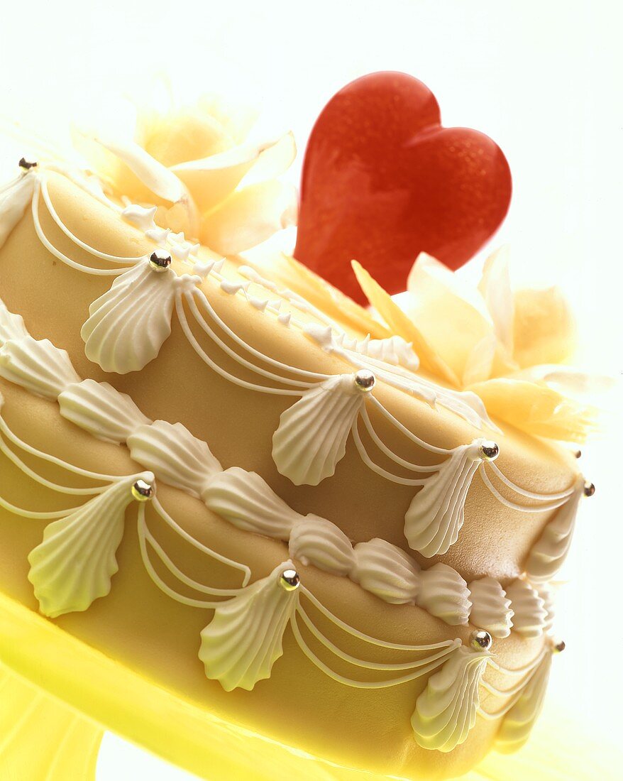 Iced marzipan cake with red heart