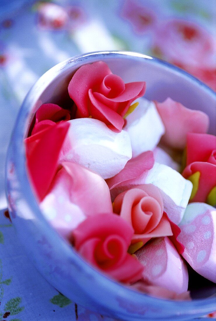 Bowl of marzipan roses and marshmallows