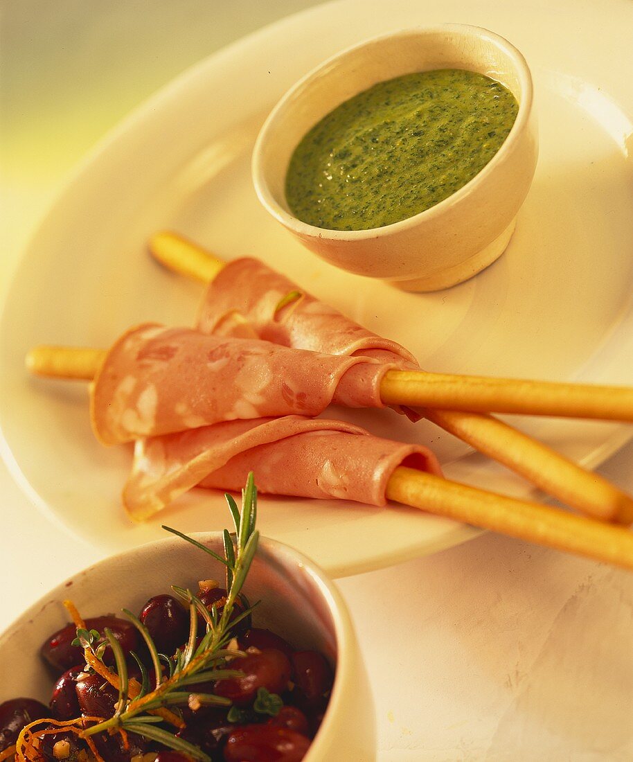 Grissini with mortadella and green sauce