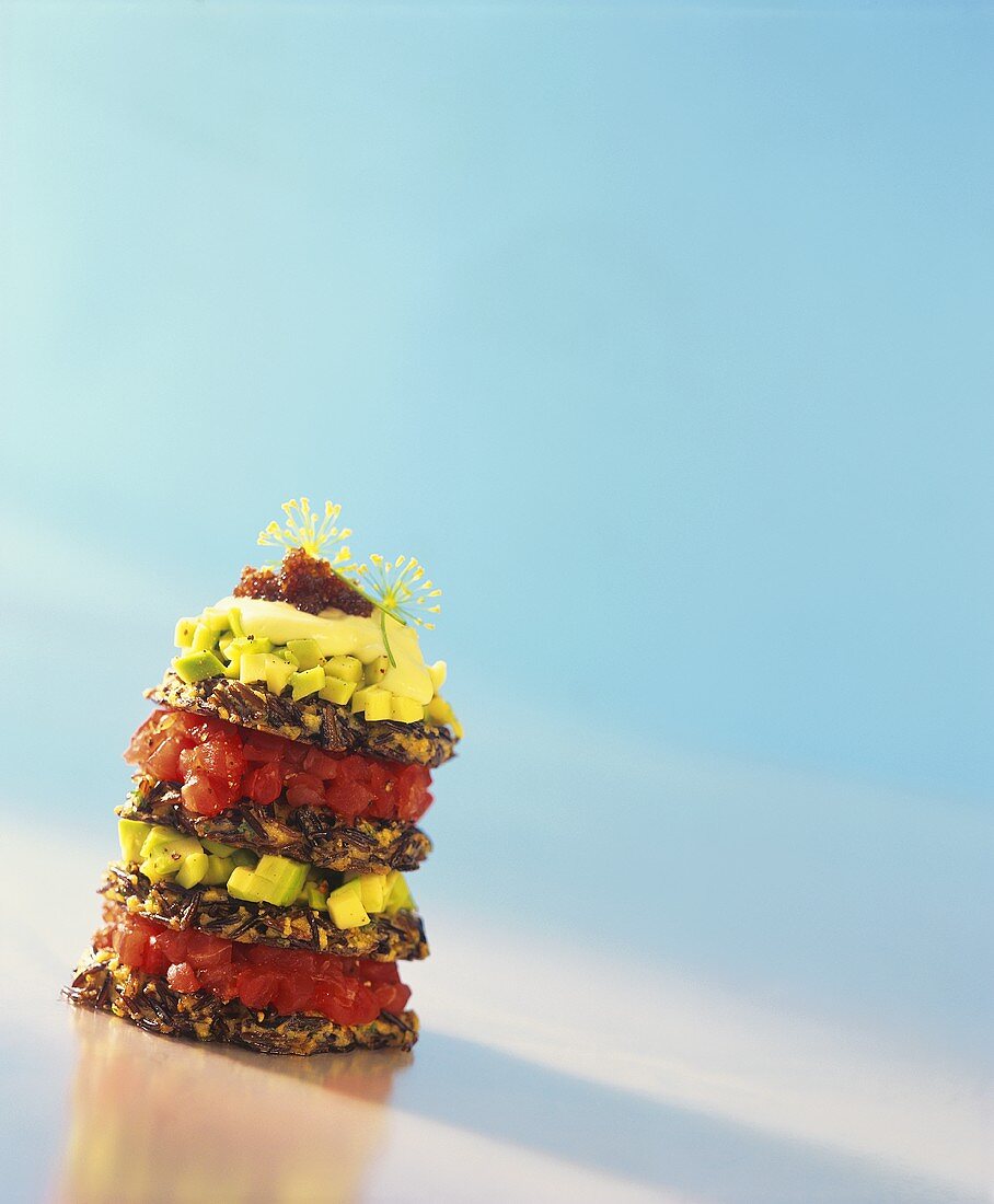 Tower of wild rice blinis, tuna tartare and avocado